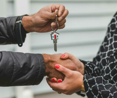 person holding silver key